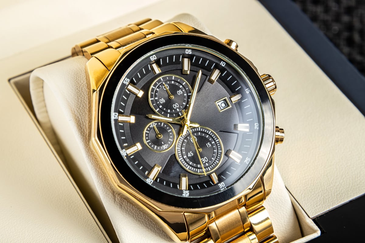 Premium black dial wristwatch with gold hands and metal bracelet