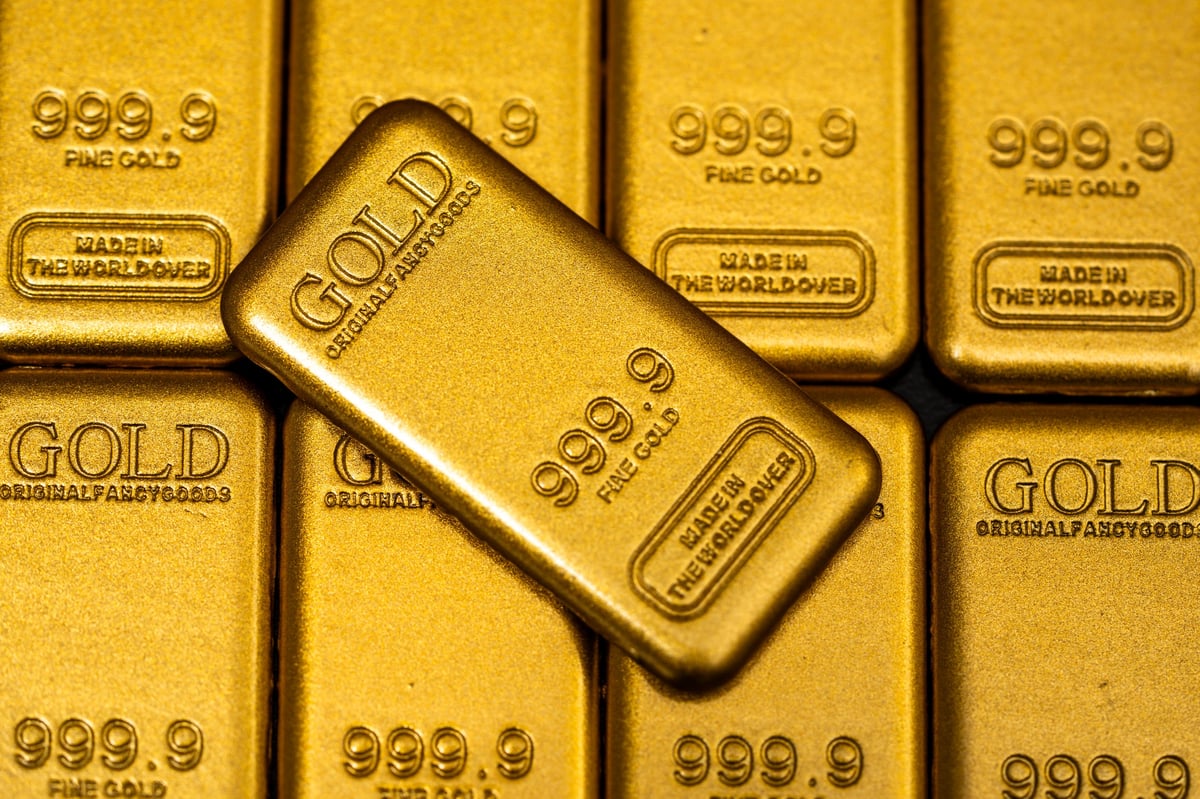 Macro close-up of a gold bar showing purity and texture
