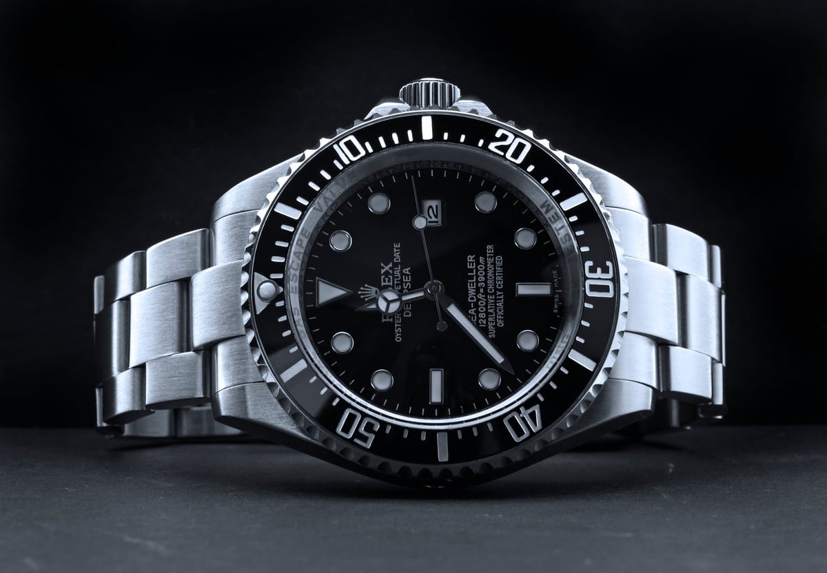 Luxury dive watch photographed on a black background